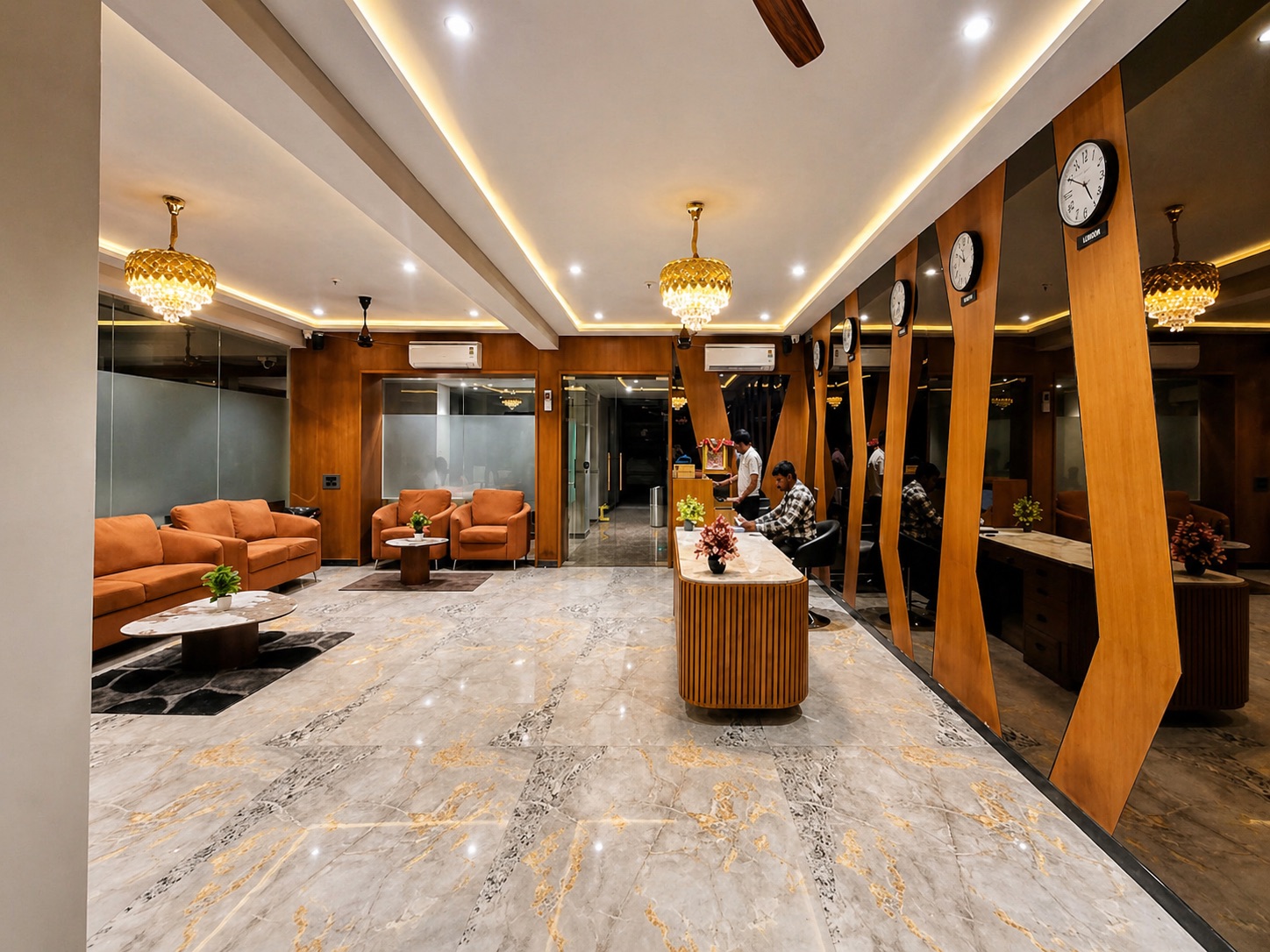 Hotel Golden Glory lobby with marble floors, crystal chandeliers, and lounge seating